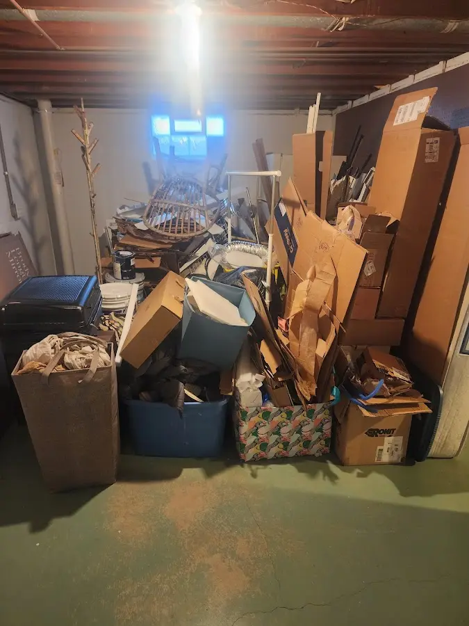 Roll-off dumpster container at job site for 2 Yard Dumpster Rental in Iona